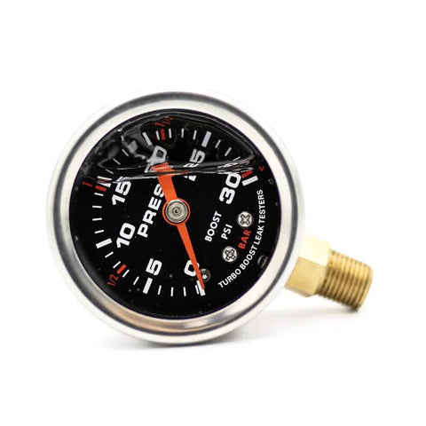 Front view of a 3-inch aluminum boost leak tester gauge with brass threaded end cap.