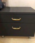 Matte black cabinet with peel-and-stick waterproof vinyl wrap, showcasing DIY makeover potential