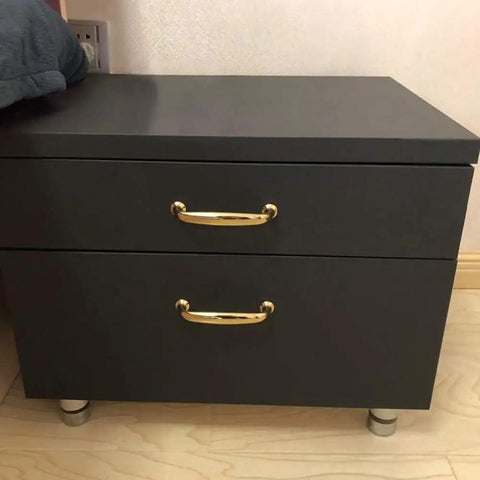 Matte black cabinet with peel-and-stick waterproof vinyl wrap, showcasing DIY makeover potential