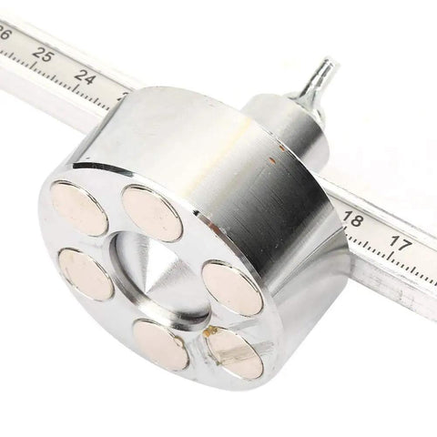 Magnetic Plasma Cutter Guide And Mount with adjustable height, six strong magnets, shown on measurement scale, metal cutting tool
