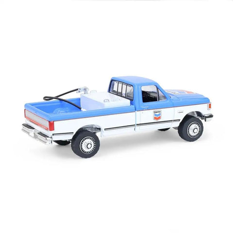 Rear side view of Ford F-250 XL 1991 Diecast Truck One Sixty Fourth Scale Chevron Emblems Blue Collar Series 14 Replica With Rubber Wheels
