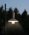 Rechargeable Outdoor Rugged Camping Flashlight Three In One Lantern with 3100mAh Power hanging on a hook outdoors