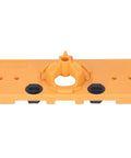 Front view of orange 35mm hinge hole jig base for cabinet doors; central circular guide and black clamps.