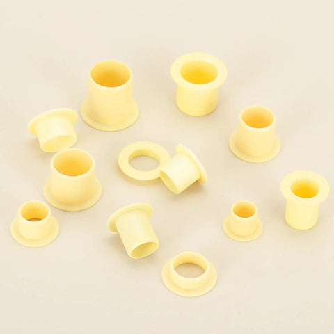 8mm ID 10mm OD Flanged Sleeve Bearing Kit POM Plastic Bushing 15mm Length Yellow 8 Pack scattered on a surface