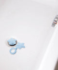 2pcs Silicone Star Shaped Bathtub Stopper Flat Cover for Drain Plug in a white bathtub with water droplets.