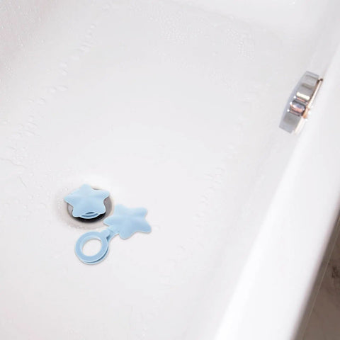 2pcs Silicone Bathtub Drain Stopper Flat Cover Shaped in a bathtub, showing blue silicone material and star design.