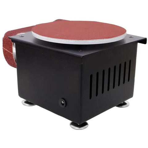 Mini Belt Sander Knife Sharpener 7 Speed Electric Grinder With Sanding Disc Forward Reverse Control Bench Polisher For Knife Making Woodworking Metal And Jewelry DIY Crafts, black metal body with a sanding disc.