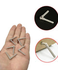 Five Pack Plastic RC Pin Hinges For Planes And Helicopters Two And A Half Millimeter By Forty Three Millimeter Gray held in hand