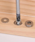 Close-up of 180 Piece Stainless Steel Flat Washer Set M2 To M10 For Fastening DIY Repairs Gasket Spacers on wooden surface