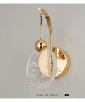 Modern LED Wall Sconce With Crystal Accent For Bedroom And Bathroom Easy Quick Install, gold finish with glass trim, light off effect.