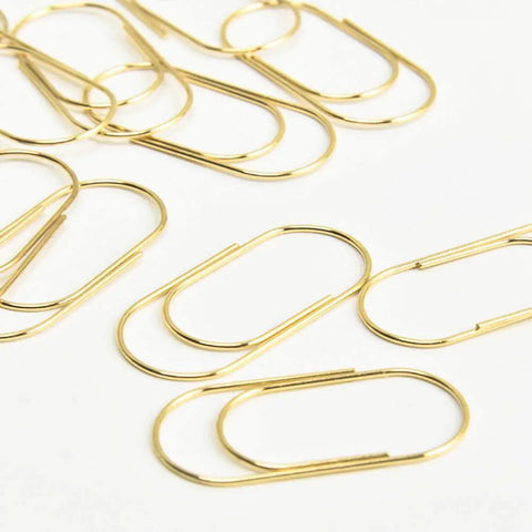 Oversized Gold Paper Clips Set, Big Ol Jumbo 2 Inch 50mm Clips, 20 Pack scattered on white background.
