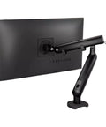 Ergonomic Desktop Monitor Mount With Buttery Smooth Mechanical Spring Arm For Single Screen sleek black arm attached to monitor.