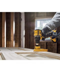 No Fuss Hella Slick 20V Max Brushless Cordless Drill Driver Kit With Compact Atomic Frame And One Half Inch Chuck Including 2Ah Lithium Ion Battery in use on wood panel
