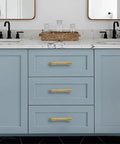 Gold Cabinet Knobs Set 10 Pack Round 1 Inch Brushed Brass Zinc Alloy on blue bathroom vanity