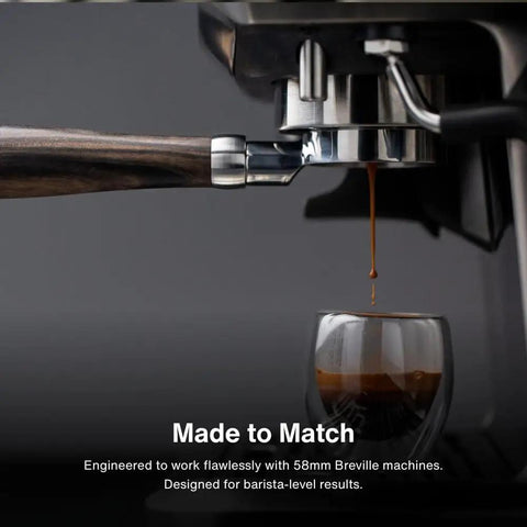 58mm Bottomless Naked Portafilter Straight Shooter Design For Breville Espresso Machines includes a wooden handle and brewing espresso.