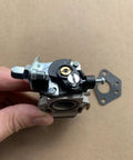 Carburetor Replacement Part For 43CC Cultivator Model 58601 DG1 Pro Grade Heavy Duty Universal Spare Kit shown in hand on brown background.