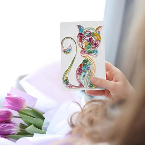 Person holding a decorated card from Beginner Friendly DIY Paper Quilling Kit With 36 Color Strips 20 Blank Cards Tools And Supplies