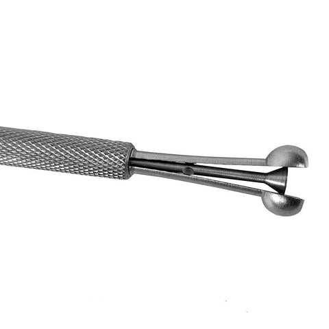 Close-up of bore gauge set, four-piece telescoping full-round bore gauge with knurled metal handle