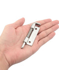 Hand holding Flat Pin Spring Latch Set 2 Pack 304 Stainless Steel 50x25mm Cabinet Door Hinge Bolt For Upper And Lower Cabinets
