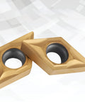 Close-up of two carbide tips from Carbide Tips Set For Lathe Turning Tools 10 Piece Boxed Set Pro Grade Heavy Duty.