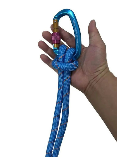 Hand holding Double Braided Arborist Rope 0.55in x 100ft Static Rope 8400 Lbs Breaking Strength with carabiner, blue