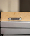 Kickass Flex Stock Guide For Portable Table Saw featuring slick rollers and a wood block secured with a metal plate.
