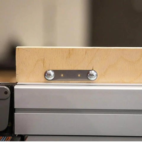 Kickass Flex Stock Guide For Portable Table Saw featuring slick rollers and a wood block secured with a metal plate.