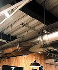 Built Tough Double Wall Stainless Steel Grease Duct 14 Inch Round 90 Degree Elbow Pre Insulated Commercial Exhaust Vent visible in restaurant ceiling.