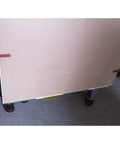 Heavy Duty Portable Drywall Lifter And Plasterboard Carrier Tool In Black Alloy With Safety Grip holding a large panel.