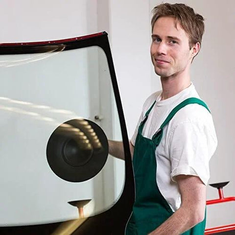 Person using 9 Inch Vacuum Concave Suction Cup Glass Lifter with Handle on auto windshield.