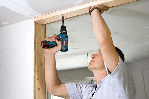 Person using 12V Max Drill Driver Kit With Two Batteries And Charger, Three-Eighths Inch Chuck, Variable Speed, Ultra Lightweight 1.8 Pounds.