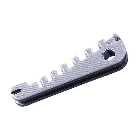 Eyeglass Frame Corrector Tool With Multi Size Slots From 3mm To 6.5mm For Temple Adjustments in silver, close-up view.
