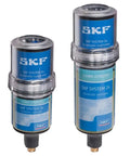 Automatic lubricators for industrial use, featuring SKF branding, showcasing two models in clear casing against a white background.