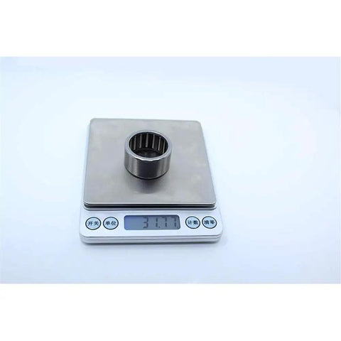 Built Tough One Way Needle Roller Bearing Drawn Cup Clutch 30x37x20mm 52100 Chrome Steel on digital scale showing weight.