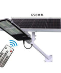 JUDYSSY Solar Floodlights mounted with a solar panel and remote, IP65 waterproof design for outdoor use.