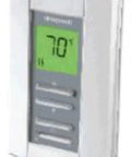 Close-up of TL7235A1003 Line Voltage Pro Non Programmable Digital Thermostat with backlit display showing 70 degrees.