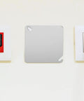 Installed 4 Pack Square Electrical Box Cover Plates for blank control panels or junction boxes in an office setting