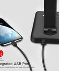 8 In 1 4th Gen Multifunctional LED Desk Lamp with USB port charging a phone, highlighting integrated charging features.