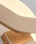 Close-up of UPRENXIAO Modern Minimalist Nordic Led Wall Sconce Wavy Twisted Design Baked bronze finish and soft light.