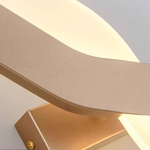 Close-up of UPRENXIAO Modern Minimalist Nordic Led Wall Sconce Wavy Twisted Design Baked bronze finish and soft light.
