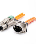 Rugged Craftsmanship Two Pin Thirty Five Amp High Voltage Electric Vehicle Connector with metal shell and orange wires.