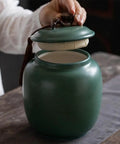 Keep Your Stash Locked Tight And Crisp With This Vintage Chinese Ceramic Tea Canister Airtight Kitchen Storage Jar Perfect For Coffee Beans Spices And Seasonings Dishwasher Safe, shown being opened.