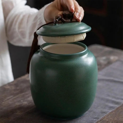 Keep Your Stash Locked Tight And Crisp With This Vintage Chinese Ceramic Tea Canister Airtight Kitchen Storage Jar Perfect For Coffee Beans Spices And Seasonings Dishwasher Safe, shown being opened.