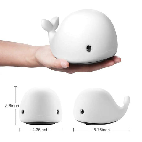 Hand holding Cute Whale Night Light for Kids with 7 Color Changing LEDs, Tap Control Silicone Baby Night Lamp, USB Rechargeable, BPA Free