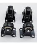 Four black heavy-duty caster wheels with mounting plates for furniture mobility