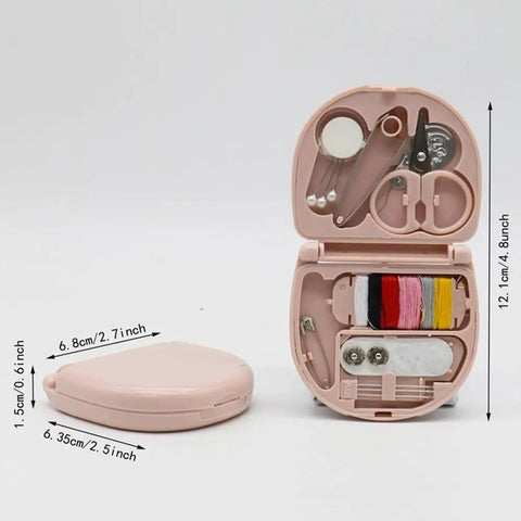 Open pink portable DIY craft box sewing kit with multicolor thread, needles, scissors, and sewing tools, dimensions shown