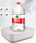 Four Pack Universal Self Adhesive Ball Casters For Heavy Storage Bins And Plastic Tubs Silent Swivel furniture glides beside water bottle on organizer.