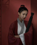 Person holding 65 Inch Sword Back Bag Cover for Katana and Shinai Travel Case with Shoulder Strap in a martial arts setting.