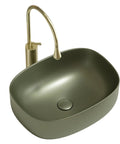 Retro Green Ceramic Above Counter Bathroom Vessel Sink, Artistic Curved Design, Scratch-Resistant & Easy-to-Clean Vanity Sink for Home, Balcony, Guest Bath (23.6in/60cm) with golden faucet.