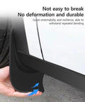 Tough Front And Rear Mud Flaps For Tesla Cybertruck 2024, flexible black mud flap being placed on vehicle for durability.